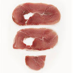Three slices of Suncrest Farms country ham center slices on a white background.