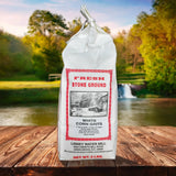 Linney Water Mill stone ground white corn grits on scenic country background.